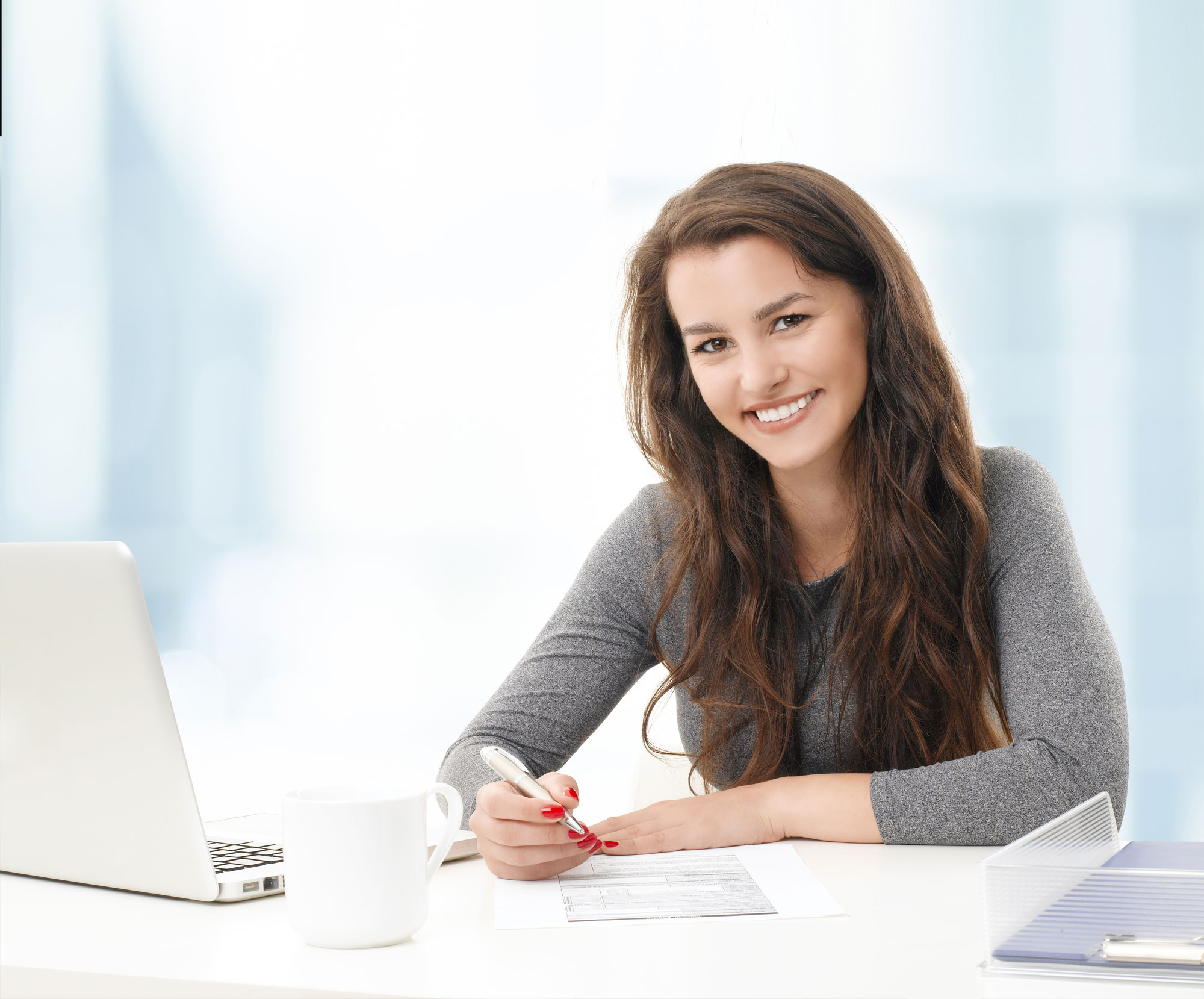 Girl sitting at desk.